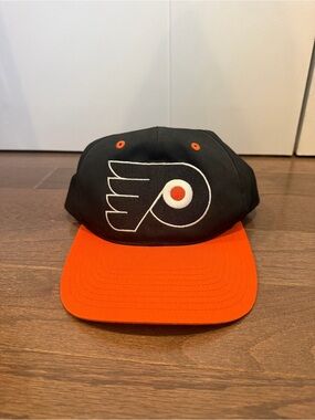 Black and Orange Hockey Logo Snapback Hat